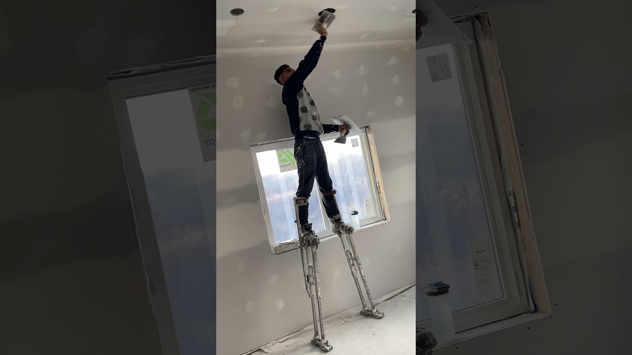 Fast Coating with Hawk and Trowel on Drywall Stilts (India)￼